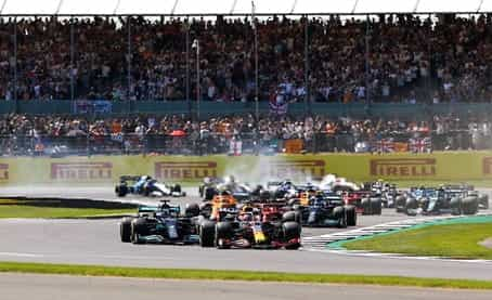 Max Verstappen leads Lewis Hamilton around the opening corners of the 2021 British GP.