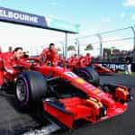 A red Ferrari Formula 1 car is pushed to the starting grid at the Australian Grand Prix.