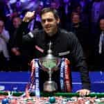 Ronnie O’Sullivan shows off his 2022 World Championship trophy.