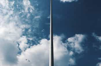 Flag of Ukraine flying against a blue sky.